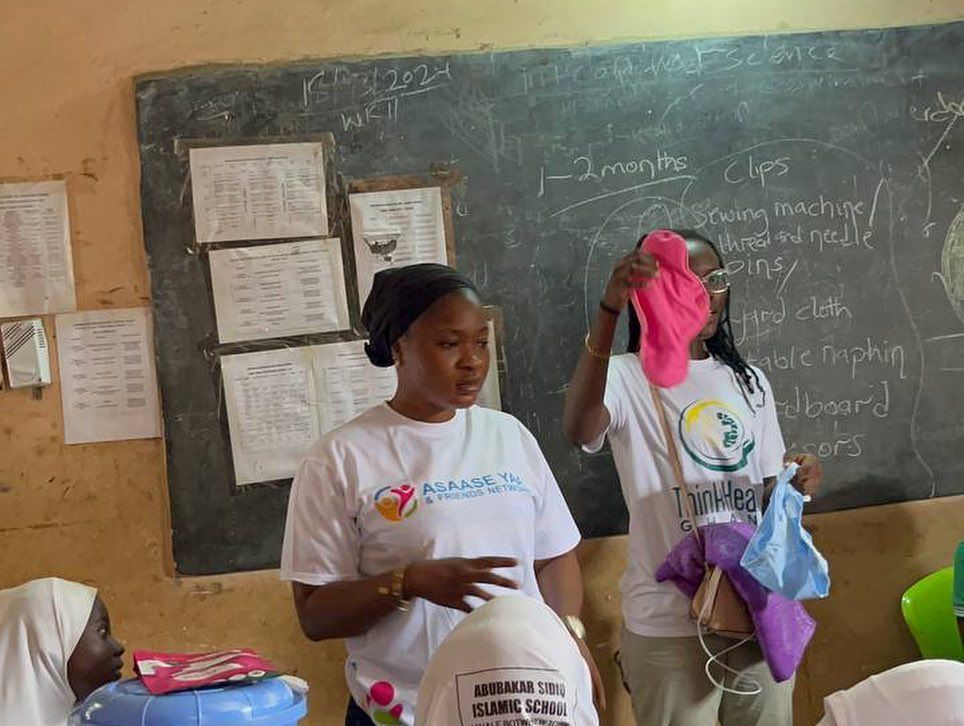 Volunteer leading a menstrual health session in a classroom